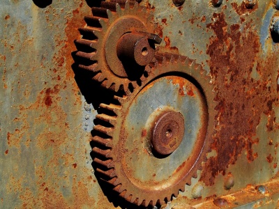 Rust is formed by the reaction of iron and which element?